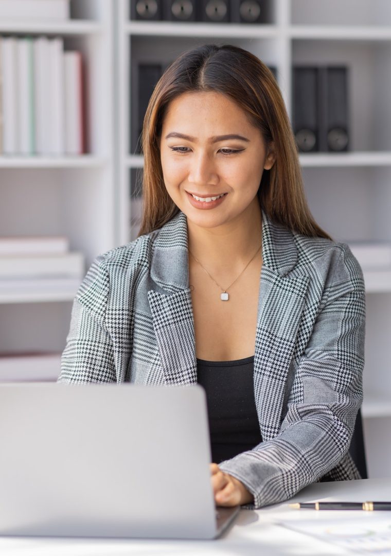 Young asian business woman manager accounting analyst checking bills, analyzing sales statistics man